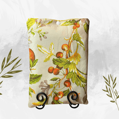 Decorative stand with floral and leaf pattern on a white background